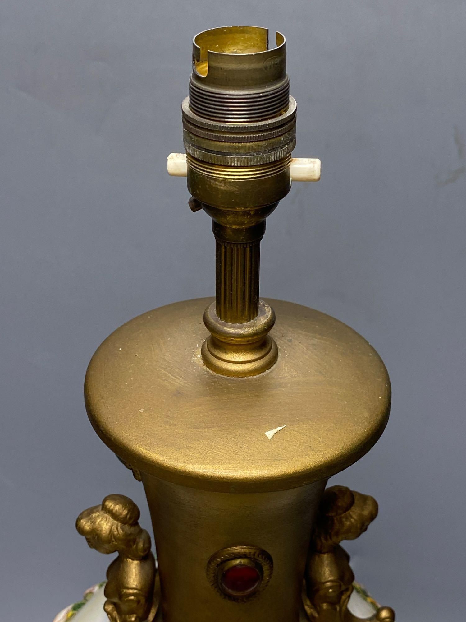 A gilt lamp stem incorporating relief-moulded body, 46cm